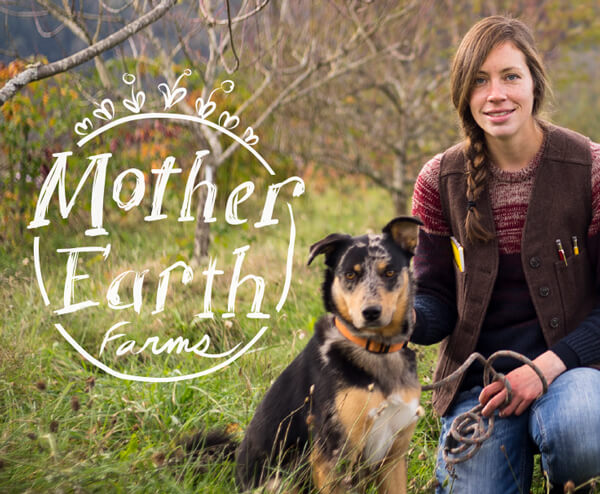 Anika Moran of Mother Earth Farms with her dog in a field.