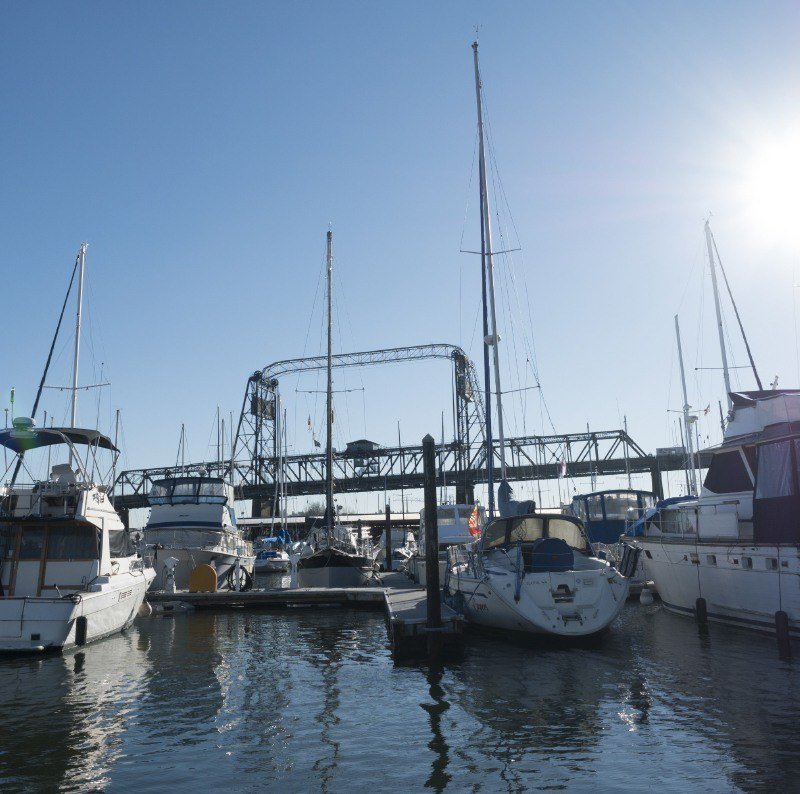 Sun shinning down on boats in a marina.