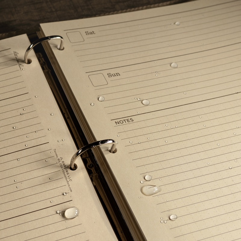 Planner containing wet large loose leaf pages