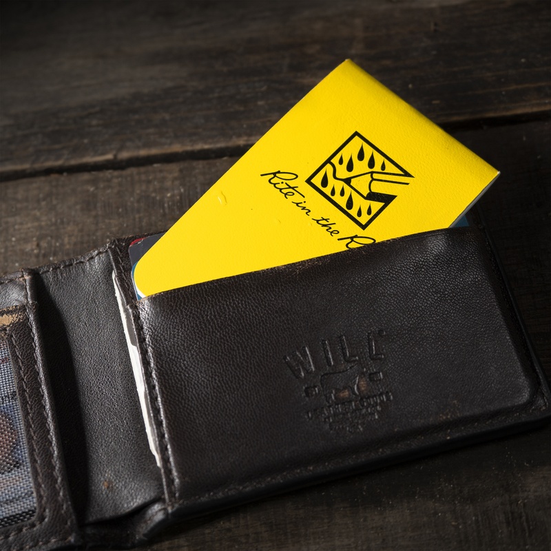 tiny notebook sticking out of wallet